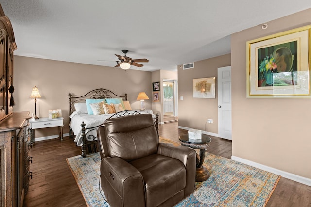 bedroom featuring dark hardwood / wood-style flooring and ceiling fan