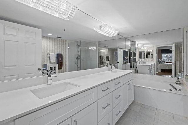 bathroom featuring tile patterned floors, vanity, and separate shower and tub