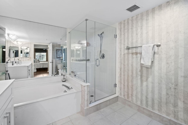 bathroom featuring tile patterned floors, vanity, and independent shower and bath