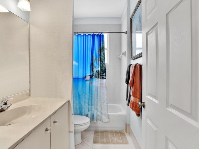 full bathroom featuring tile patterned flooring, shower / tub combo with curtain, vanity, and toilet