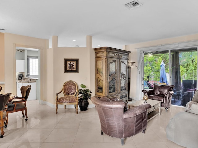 living room with light tile patterned floors