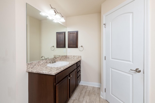 bathroom featuring vanity and wood-type flooring