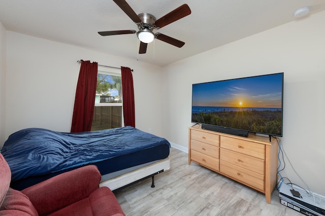 bedroom featuring light hardwood / wood-style floors and ceiling fan