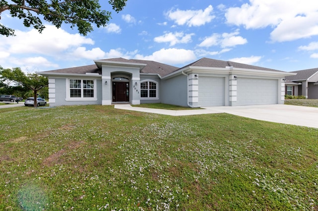 ranch-style home featuring a garage and a front lawn