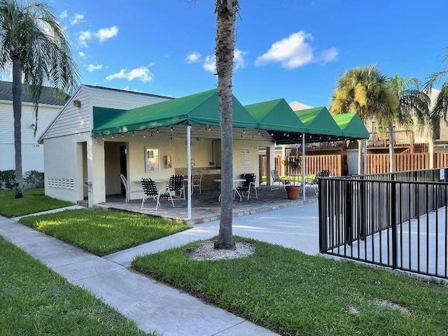 exterior space featuring a yard and a patio