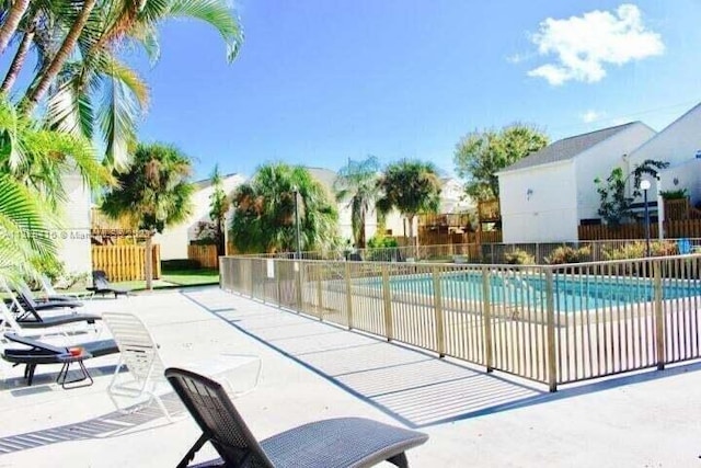 view of swimming pool featuring a patio