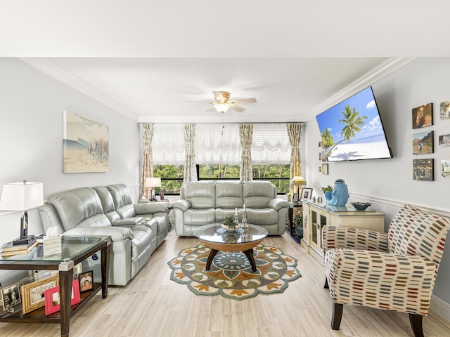 living room featuring ceiling fan, light hardwood / wood-style floors, and ornamental molding