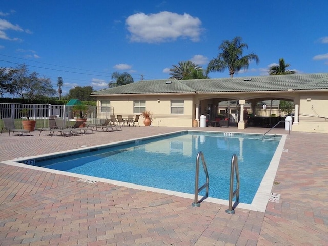 view of pool featuring a patio