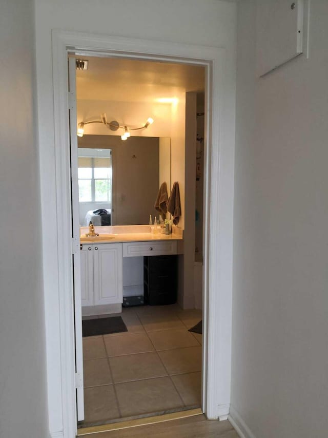 hall featuring tile patterned flooring