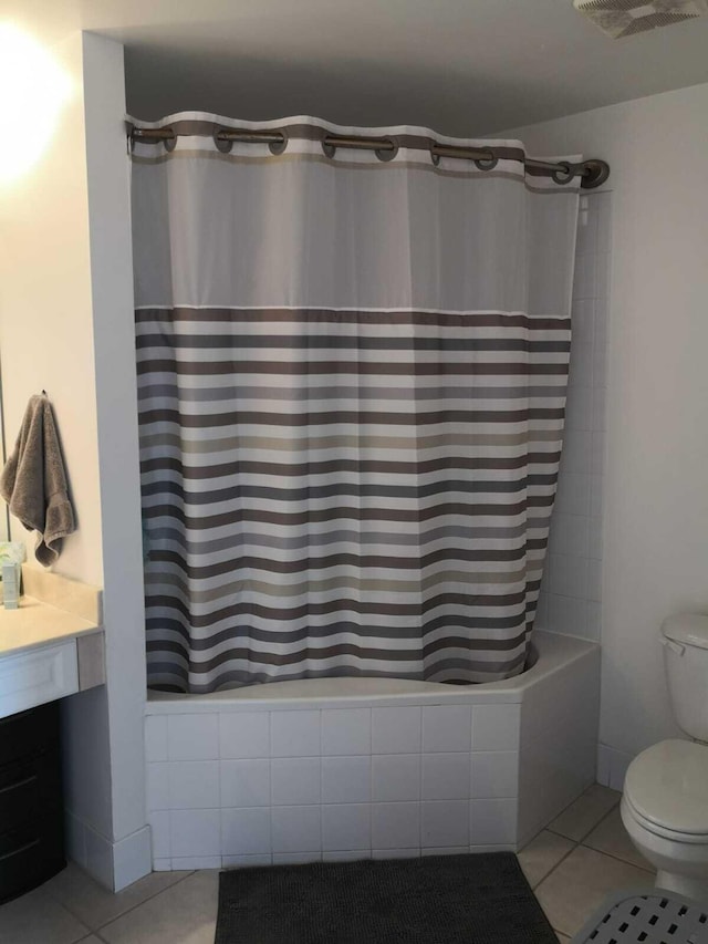 bathroom featuring tile patterned flooring and toilet