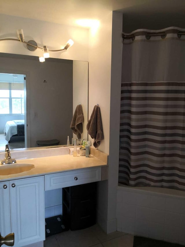 bathroom featuring tile patterned flooring and vanity