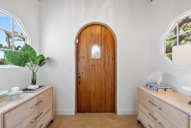 entryway featuring light parquet flooring and plenty of natural light