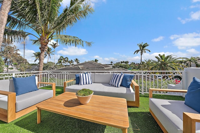 wooden terrace with an outdoor hangout area