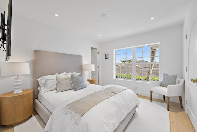 bedroom with light wood-type flooring