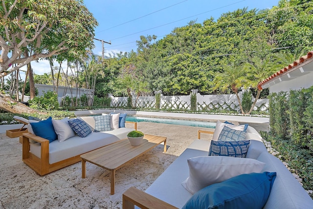 view of patio / terrace featuring a fenced in pool and an outdoor hangout area