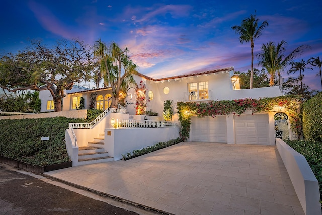 mediterranean / spanish-style home featuring a garage