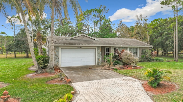 ranch-style home with a front yard and a garage