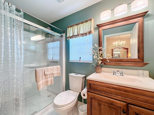 bathroom featuring a shower with curtain, vanity, a notable chandelier, tile patterned flooring, and toilet