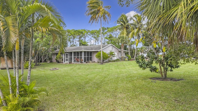 view of yard featuring a sunroom