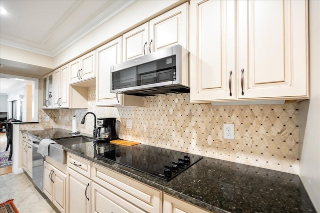 kitchen featuring dark stone counters, backsplash, crown molding, and stainless steel appliances