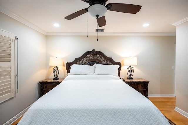 bedroom featuring light wood-type flooring, ceiling fan, and ornamental molding