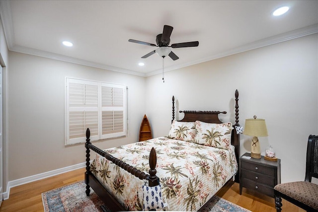 bedroom featuring ceiling fan, light wood-type flooring, and ornamental molding