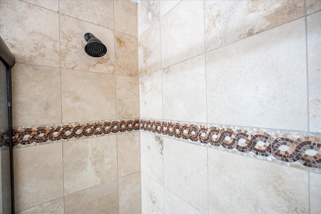 details with a tile shower