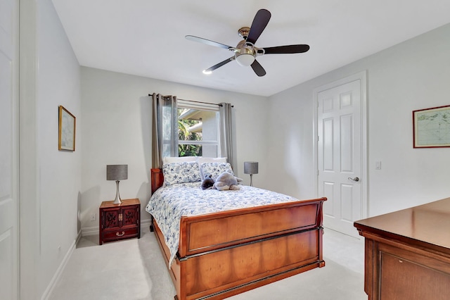 bedroom with ceiling fan and light colored carpet