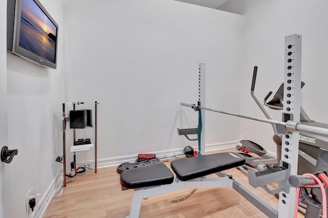 workout area featuring light wood-type flooring