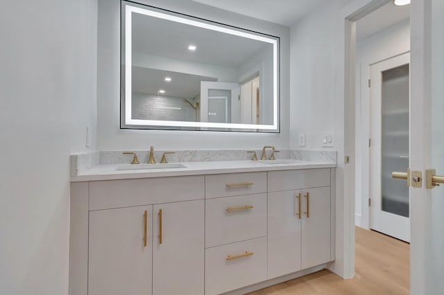 bathroom featuring hardwood / wood-style flooring and vanity