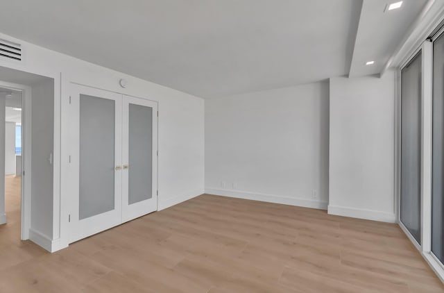 interior space with light wood-type flooring and a closet