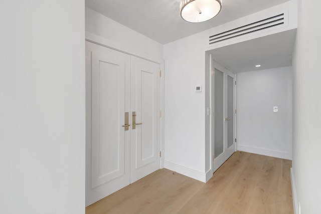 hallway featuring light wood-type flooring