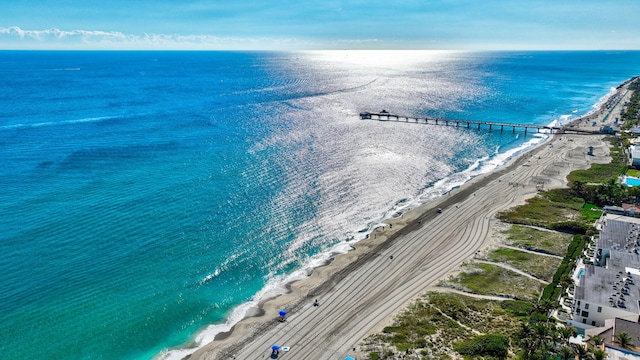 aerial view featuring a water view and a view of the beach