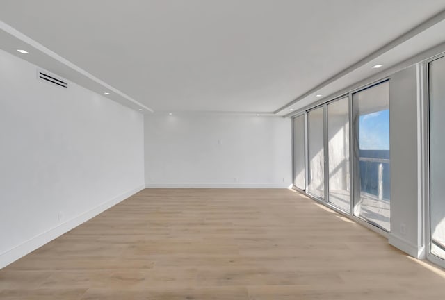 unfurnished room featuring light wood-type flooring