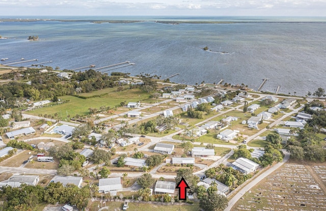 bird's eye view featuring a residential view and a water view