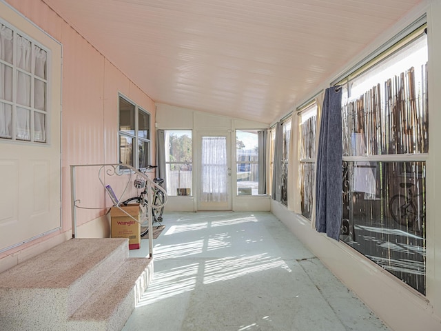 sunroom featuring lofted ceiling