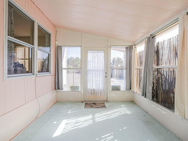 unfurnished sunroom featuring lofted ceiling