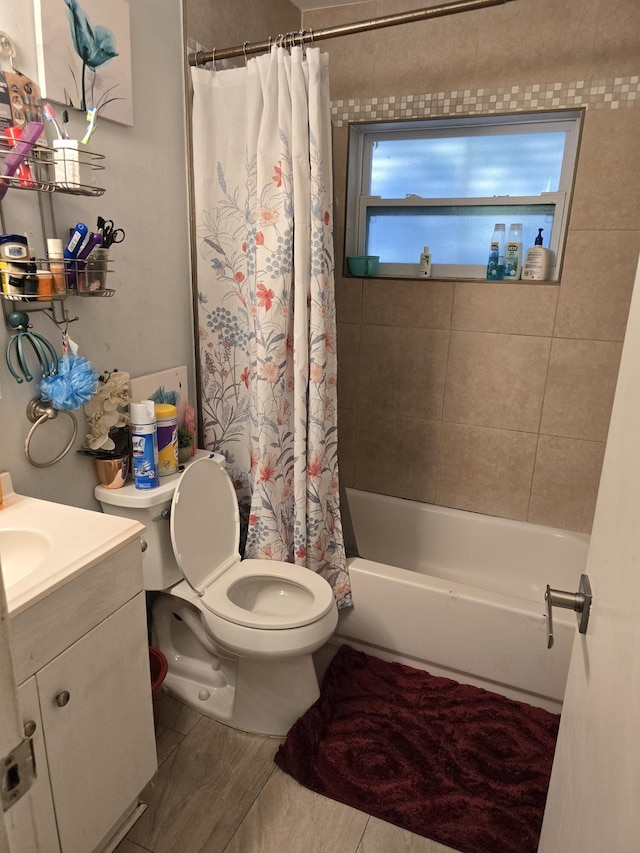 full bathroom with vanity, toilet, and shower / bath combo with shower curtain