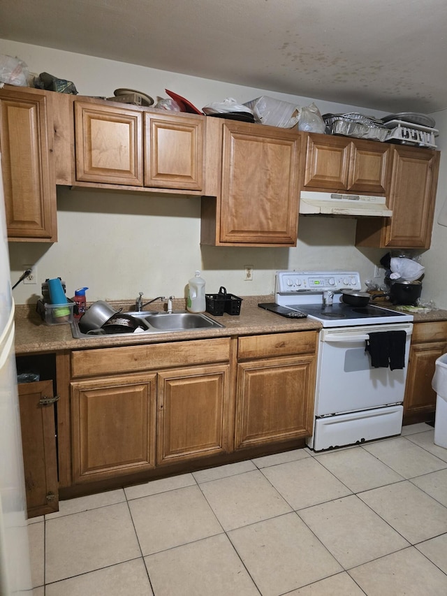 kitchen with electric stove, sink, and light tile patterned flooring