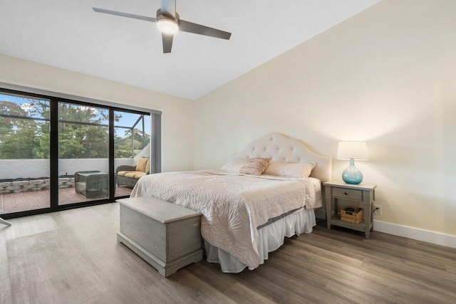 bedroom featuring access to outside, hardwood / wood-style flooring, vaulted ceiling, and ceiling fan