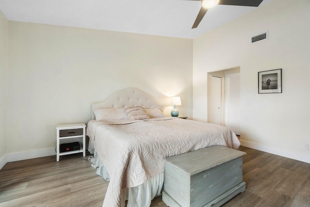 bedroom with wood-type flooring and ceiling fan