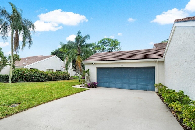 exterior space featuring a front lawn and a garage