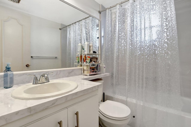 full bathroom with vanity, toilet, and shower / tub combo with curtain