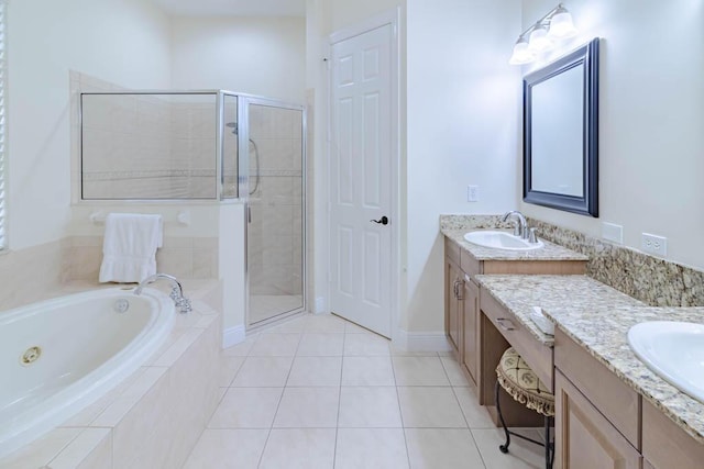 full bath featuring a stall shower, two vanities, and a sink