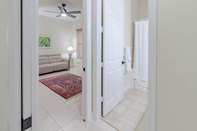 hall featuring light tile patterned flooring