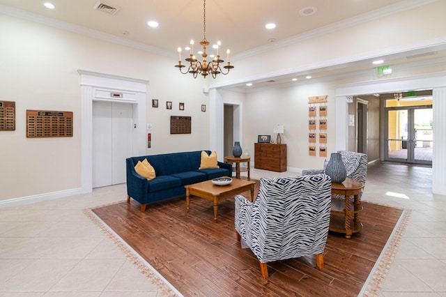 living area featuring crown molding, light tile patterned floors, french doors, and visible vents