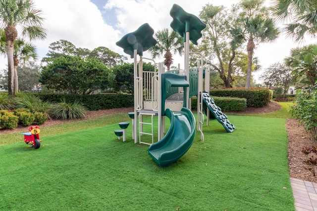 community play area featuring a lawn