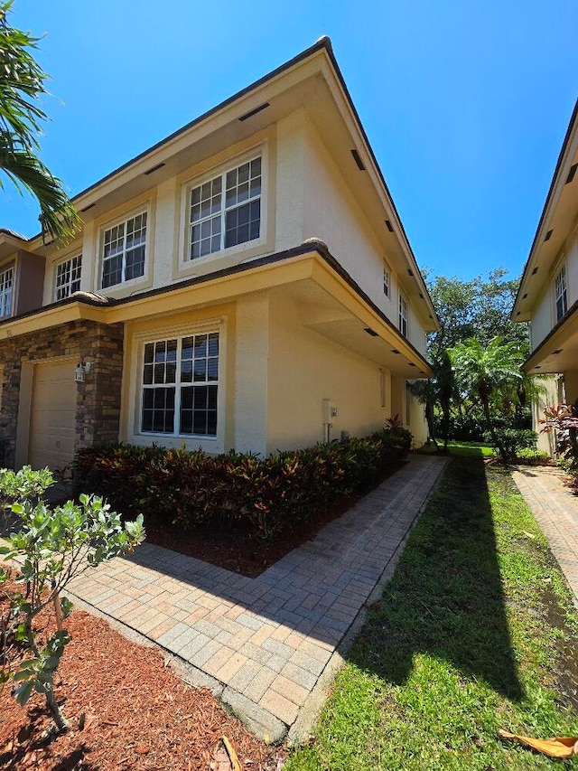 view of property exterior with a garage