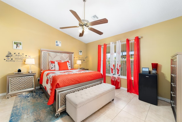 tiled bedroom featuring ceiling fan and lofted ceiling