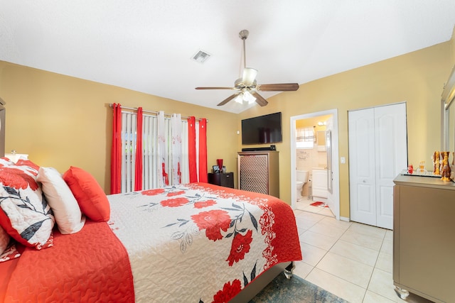 bedroom with ensuite bath, ceiling fan, a closet, and light tile patterned floors